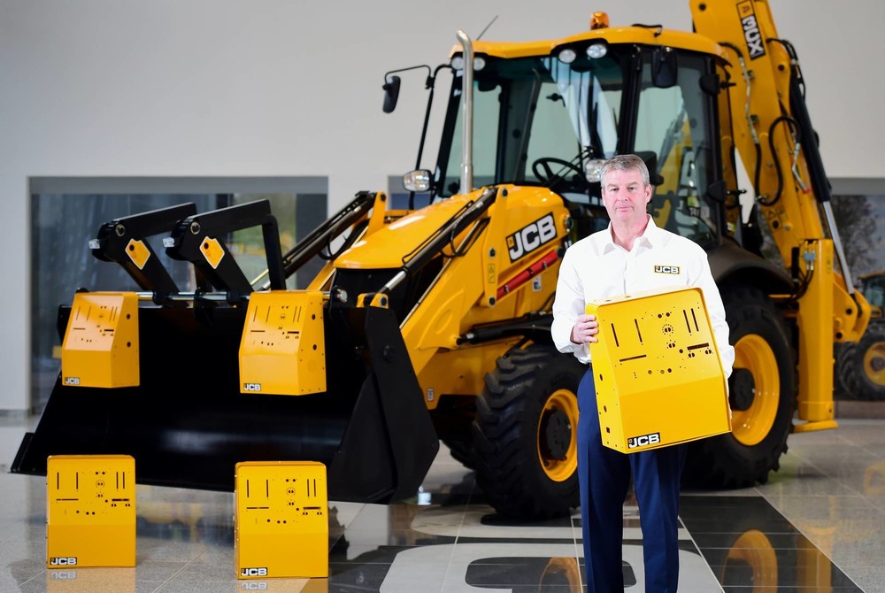 JCB Chief Innovation and Growth Officer Tim Burnhope pictured with the ventilator housing prototypes (1920).jpg